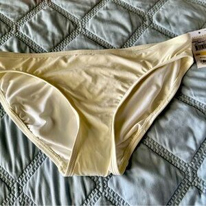 Michael Kors cream color bikini bottom with ruched sides size M